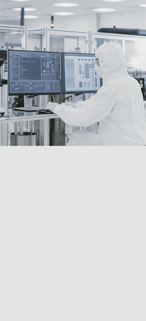 Technician working in a quality-controlled production facility